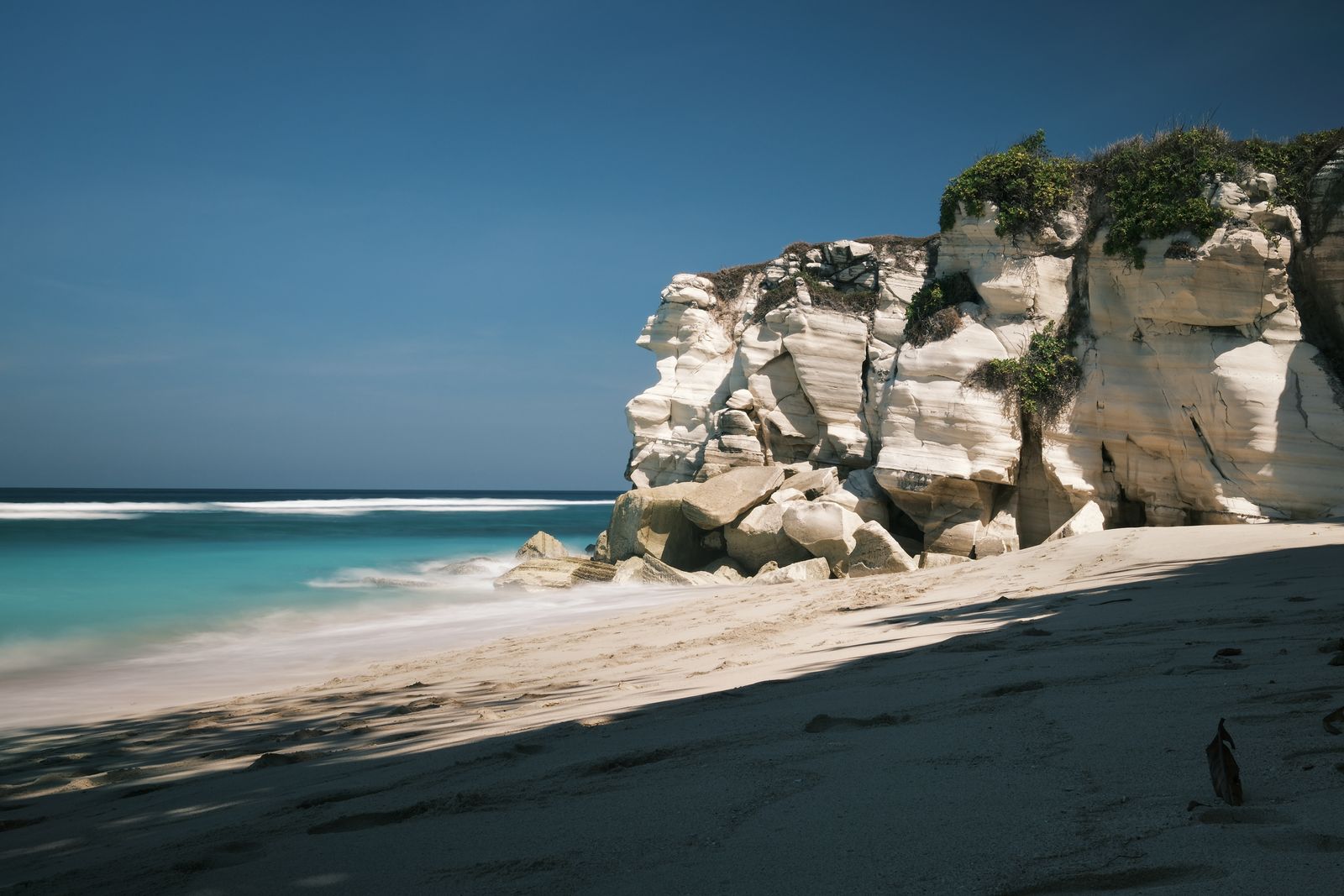 Limestone cliffs above an empty beach